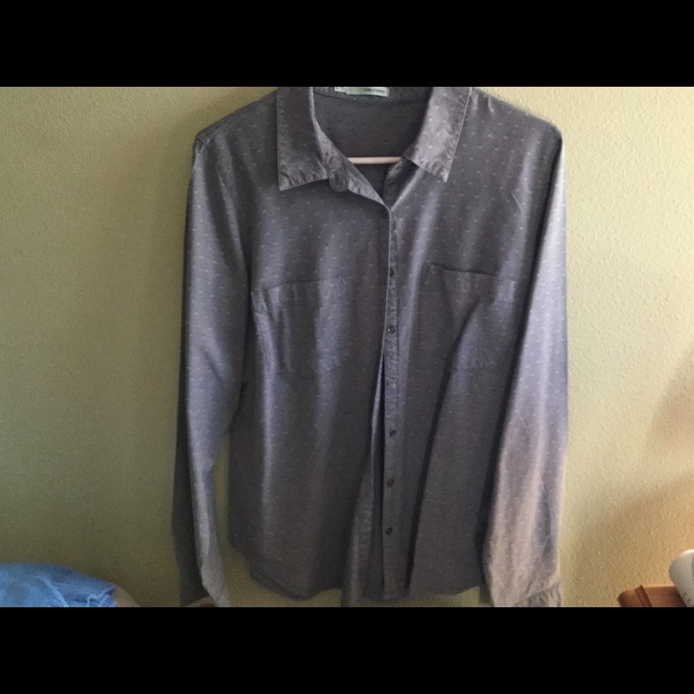 Maurice’s blue button-down shirt